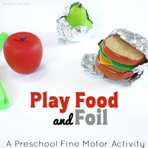 Play food and foil- this is great fine motor work for preschoolers! Great idea to add to the play kitchen as well.