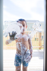 Make big, messy, awesome art using just shaving cream and a sliding glass door! Great summer art activity!